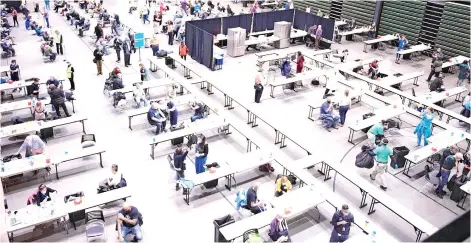  ?? — AFP photo ?? Seattle-area medical network Virginia Mason held a Covid-19 vaccine clinic at the Amazon Meeting Center that aimed to vaccinate 2000 individual­s that day, in downtown Seattle, Washington.