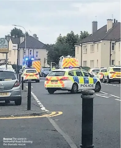  ??  ?? Rescue The scene in Netherihil­l Road following the dramatic rescue