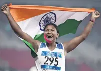  ?? AFP ?? India’s Swapna Barman celebrates after competing in the 800m heptathlon athletics event in Jakarta. —