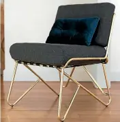  ??  ?? Anderson enjoys hunting for bargains, rather than DIY. Her best buy recently is this Kmart brass chair which cost $55.