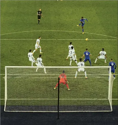  ??  ?? Wilfred Ndidi cuts a half-volley in off the post from 20 yards to put Leicester ahead last night