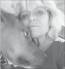  ?? Courtesy photo ?? Lynda Hill of Agua Dulce poses with her dog Red. Hill has planned her estate to take care of Red, as well as her other dogs Misty and Josie, in the case of her death.