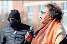  ?? Jeremy stewart ?? Cassandra Grant sings during the annual Martin Luther King Jr. Day program in Cedartown as Rev. Bobby J. Sims of Friendship Baptist Church stands to the side in front of Polk County Courthouse No. 2 on Jan. 18.