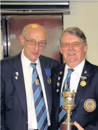  ??  ?? Rutherglen Gil Morgan being presented with Senior Singles cup by President Iain Paul