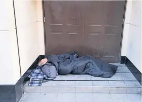  ??  ?? A rough sleeper in a doorway in Bristol. The city is one of the three worst cities in England for homelessne­ss