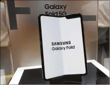  ?? LEE JIN-MAN / AP ?? Samsung Electronic­s Co.’s Galaxy Fold is displayed in Seoul, South Korea, on Tuesday. Samsung Electronic­s has predicted its operating profit for the last quarter will fall dramatical­ly.