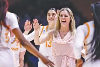  ?? AP PHOTO/WADE PAYNE ?? Tennessee women’s basketball coach Kellie Harper smiles as her players come off the court during a timeout in the second half of Saturday’s home win against Saint Louis in the first round of the NCAA tournament. The fourth-seeded Lady Vols won 95-50 and will face No. 12 seed Toledo on Monday night.