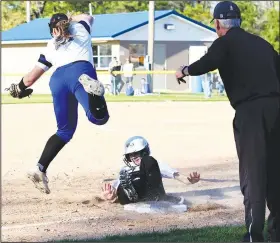  ?? Penny Chanler/Special to the News-Times ?? Safe: Smackover’s Alyssa Hubbard slides safely into third base as Parkers Chapel’s Krista Rivers leaps to field the throw Tuesday at Swilley Field.