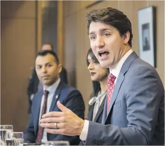  ??  ?? Prime Minister Justin Trudeau, alongside Liberal MPs, from left, Marwan Tabbara and Bardish Chagger meet with Region of Waterloo mayors and delivers brief opening remarks in Kitchener, Ont., in April last year.