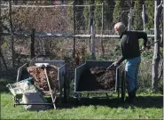  ?? LEE REICH — THE ASSOCIATED PRESS ?? This undated photo shows mulches ready for spreading in New Paltz, N.Y. Compost and wood chips are among the many organic mulches that provide multiple benefits to plants and the soil when spread on top of the ground.