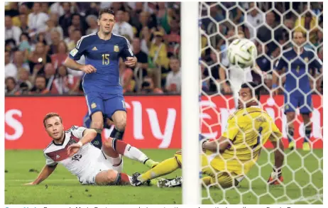  ?? AP ?? Super Mario: Germany’s Mario Goetze scores during extra-time as Argentina’s goalkeeper Sergio Romero watches in vain in the World Cup final.