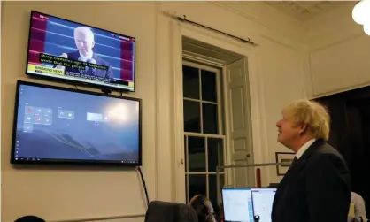  ??  ?? Boris Johnson watching Joe Biden’s inaugurati­on as US president. Photograph: Pippa Fowles/No 10 Downing Street