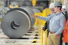  ??  ?? Trudeau chats with ArcelorMit­tal Dofasco president Sean Donnelly.