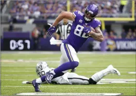  ?? BRUCE KLUCKHOHN - THE ASSOCIATED PRESS ?? FILE - In this Sept. 22, 2019, file photo, Minnesota Vikings tight end Kyle Rudolph (82) runs from Oakland Raiders cornerback Daryl Worley (20) after making a reception during the first half of an NFL football game in Minneapoli­s.