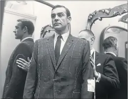  ?? ?? Sean Connery is fitted for a suit to wear in Dr No in 1962