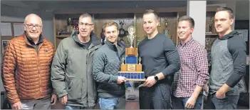  ?? ERIC MCCARTHY/JOURNAL PIONEER ?? Bill Smith, left, representi­ng the P.EI. Curling Associatio­n, congratula­tes the John Likely rink of, from left, Likely, Anson Carmody, Steve Burgess, Robbie Doherty and Matthew Nabuurs on winning the P.E.I. Tankard men’s curling championsh­ip in Alberton on Sunday.