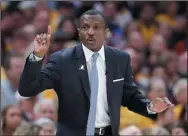  ?? THE CANADIAN PRESS/AP/TONY DEJAK ?? Toronto Raptors head coach Dwane Casey gestures against the Cleveland Cavaliers in the first half of Game 4 of an NBA basketball second-round playoff series, Monday in Cleveland.