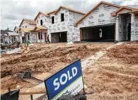  ??  ?? Builders across the region are restrictin­g the number of new homes for sale to keep from being overwhelme­d by demand.