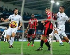  ??  ?? EASY DOES IT: Ryan Fraser nets Bournemout­h’s second goal