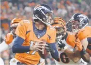  ??  ?? dec. 28:
Osweiler helped the Broncos rally froma 14-0 deficit and defeat the Bengals 20-17 in overtime, clinching a playoff berth. AAron Ontiveroz, The Denver Post