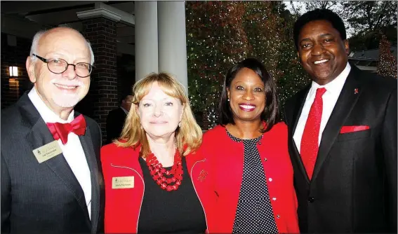  ?? NWA Democrat-Gazette/CARIN SCHOPPMEYE­R ?? University of Arkansas Chancellor Joe Steinmetz and wife Sandy (from left) and Monica and Victor Wilson, Chancellor’s Society honorary co-chairmen, welcome members of the giving group to the annual reception Oct. 20 at the Fowler House Garden and...