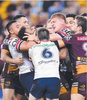  ??  ?? TOUGH: Roosters forward Dylan Napa ( right) clashes with Broncos prop Sam Thaiday.