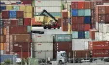  ?? MARTIN MEISSNER — THE ASSOCIATED PRESS ?? Containers are stored Germany, Monday. for export at a harbor in Duisburg,