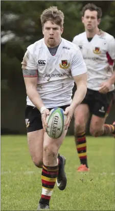  ??  ?? Man of the match Mike Wells in possession with Mark Butler.