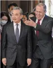  ?? ALEXANDER NEMENOV THE ASSOCIATED PRESS ?? Russian Foreign Minister Sergey Lavrov, right, welcomes China’s foreign policy chief, Wang Yi, to talks in Moscow on Wednesday. The visit is raising concern in the West that Beijing may offering Russia support for its operation in Ukraine.