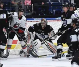  ?? ANDY CAMP PHOTO ?? Cullen Bradshaw (white jersey, left) looks for a pass during a recent Thunder game. Adirondack is on the road this weekend with two games at Manchester and one at Worcester.