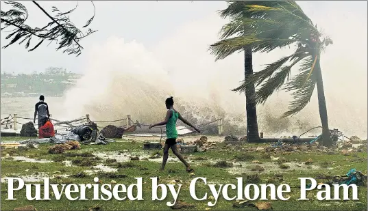  ?? REUTERS/AP ?? The scenes in Port Vila, the capital of Vanuatu after it was hit by winds in excess of 200mph from Cyclone Pam. Dozens are feared dead, particular­ly, in outlying islands. ‘We’ve seen villages that have just literally been blown away,’ said one aid worker