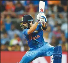  ??  ?? India’s Virat Kohli plays a shot during the World T20 men’s semifinal match between India and West Indies at the Wankhede Cricket Stadium in Mumbai onMarch 31.