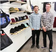  ??  ?? MOTIF Marketing partner Nathan Hursh, left, and owner Joel Antymniuk hope to bring some new ideas to an older industry, saying they want to go beyond applying business logos to pieces of clothing and merchandis­e.