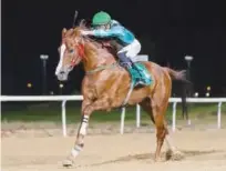  ??  ?? Inthar under Bernardo Pinheiro wins 2000m Purebred Arabian race in Al Ain on Thursday.