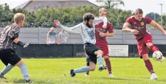  ?? Richard Birch ?? Caernarfon Town’s Jamie Breese smashes the ball past the Holyhead Town goalkeeper.