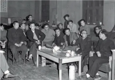  ??  ?? Lao She (2nd right), the author, Jiao Juyin (right), director of the BPAT, and Xia Chun (3rd right), also a BPAT director, work on the plots of Teahouse. In 1956, Lao She (1899-1966, born Shu Qingchun), a modern Chinese literary figure and artist,...