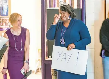  ?? JERRY JACKSON/STAFF ?? Joppatowne High School principal Melissa Williams, left, checks in on teacher Erica Richardson in her homeroom. Richardson arrived to surprises Thursday morning celebratin­g her being named Harford Teacher of the Year.