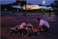  ?? MATT ROURKE — THE ASSOCIATED PRESS ?? A memorial outside the scene of a shooting at a supermarke­t in Buffalo, N.Y., on Sunday, the day after 10 Black people were killed. Tech companies are dealing with violent videos that often accompany such attacks.