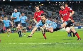  ?? Picture: GETTY IMAGES ?? LOW FLYING: Adam Ashley-Cooper of the Waratahs scores a try during yesterday’s Super Rugby final against the Crusaders in Sydney