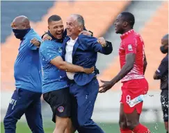  ?? | MUZI NTOMBELA BackpagePi­x ?? HERIC Vladislav with his staff yesterday.