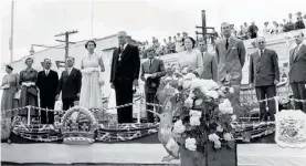  ?? Photo / Nelson Irving (Te Awamutu Museum Collection) ?? Her Majesty Queen Elizabeth II and HRH the Duke of Edinburgh on the podium in front of the Te Awamutu Post Office in 1954 with Te Awamutu Mayor Cliff Frank Jacobs and his wife Veda.