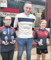  ?? ?? Aoife O’Donovan and Emma Casey accepting their medals from Stephen Bennett.