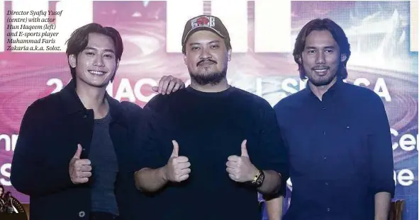  ?? ?? Director Syafiq Yusof (centre) with actor Hun Haqeem (left) and E-sports player Muhammad Faris Zakaria a.k.a. Soloz.