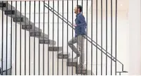  ?? COLE BURSTON TORONTO STAR ?? NOW: The stairway and slat divider draw light into the house.