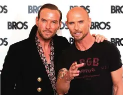  ?? — AFP ?? British singers Matt Goss (left) and Luke Goss, from the British band Bros, pose together during a photo-call at the Yam Yard Hotel in central London yesterday.