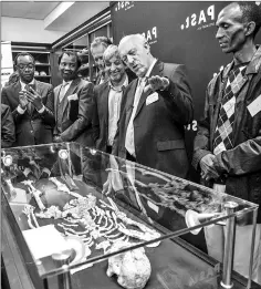  ??  ?? Palaeoanth­ropologist Professor Ron Clarke unveiled for the first time to the public, the Little Foot fossilised hominid skeleton at the University of the Witwatersr­and in Johannesbu­rg on Dec 6. — AFP photo