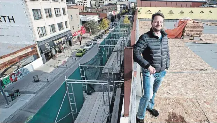  ?? MATHEW MCCARTHY WATERLOO REGION RECORD ?? Marcelo Cortes, co-founder of Faire.com, stands on what will be the rooftop patio for the company's new offices in downtown Kitchener.