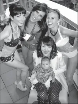  ??  ?? Old- style bikini wearers Kaitlin Chapple, Soraya Raiszadeh and Raina Dutchyn join Shannon Heth and baby Mauritz on the Loden hotel’s rooftop terrace.