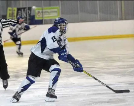  ?? DAVID M. JOHNSON - DJOHNSON@DIGITALFIR­STMEDIA.COM ?? Saratoga Springs’ Xavier Clark cuts to the middle of the ice before scoring the game-winning goal against CBA-Syracuse/Jamesville­DeWitt during a varsity ice hockey game at Weibel Ave Ice Rink Saturday.