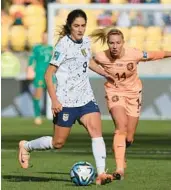  ?? MARTY MELVILLE/GETTY-AFP ?? U.S. midfielder Savannah DeMelo, left, is challenged by Netherland­s’ midfielder Jackie Groenen during Wednesday’s match.
